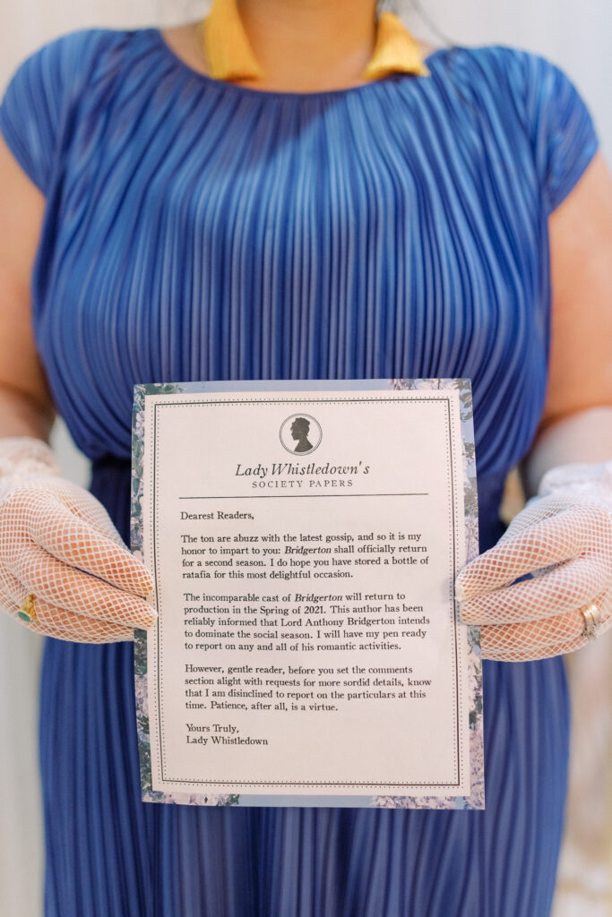  Wedding guest holding an invitation
