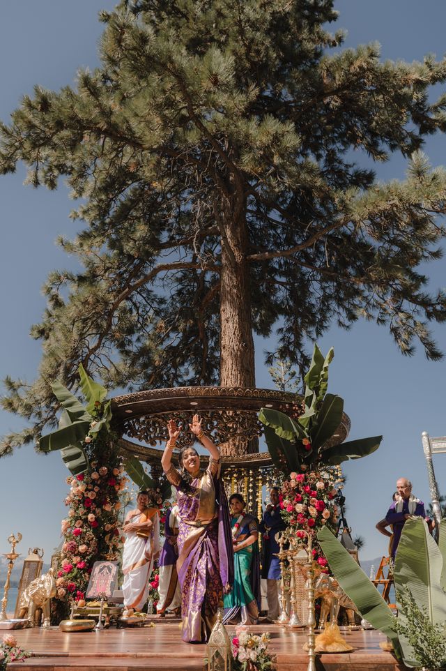 Luxury outdoor Hindu wedding ceremony with floral mandap and traditional Indian wedding celebration